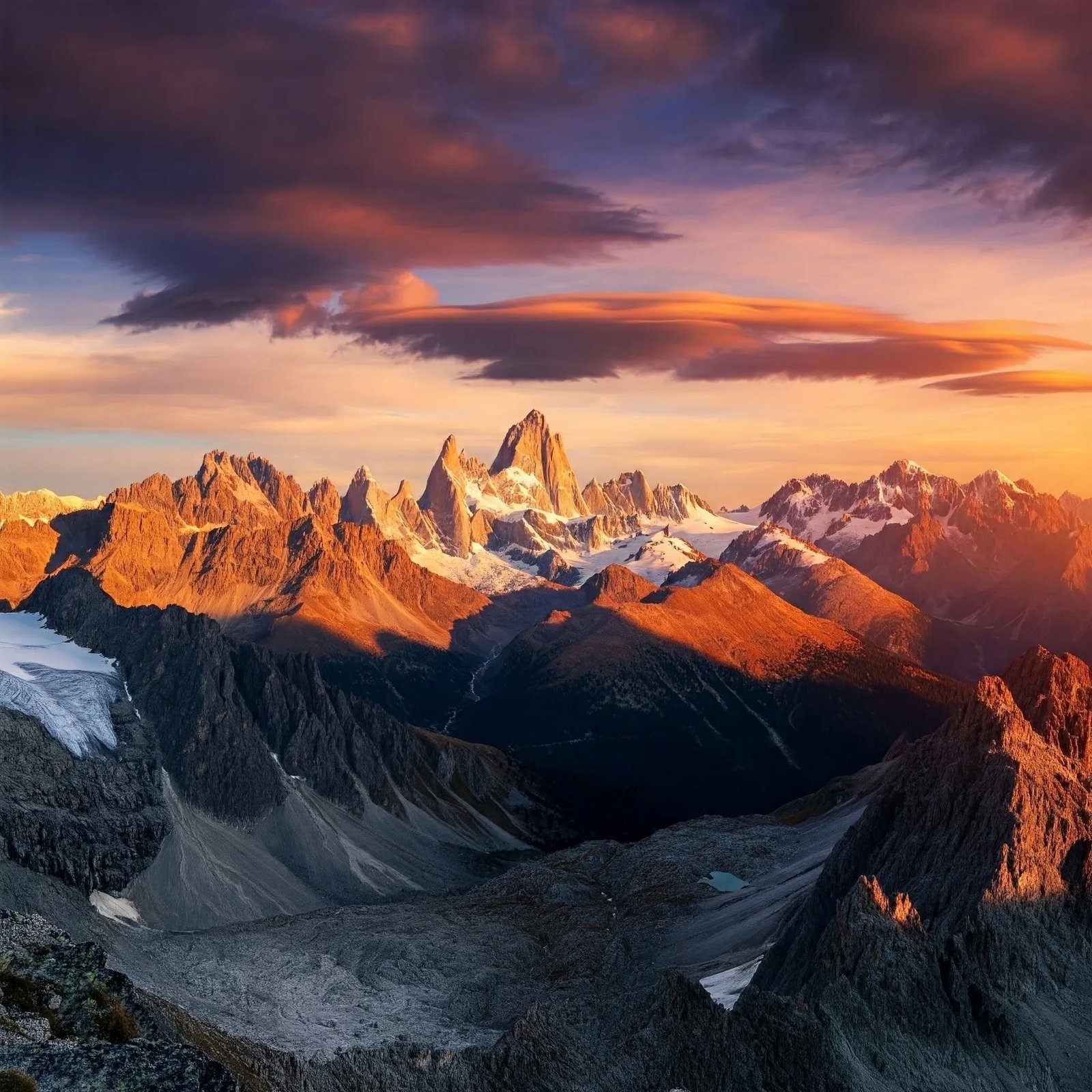 AI Generated Image of Mountains Landscape at Sunset A breathtaking panoramic view of a majestic mountain range bathed in the golden hues of a setting sun. Snow-capped peaks, rugged terrain, and a dramatic sky create a stunning natural scene.